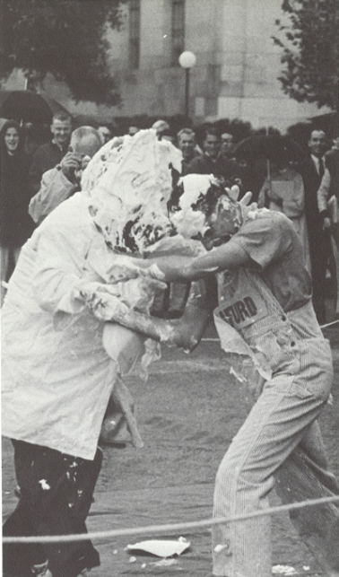Archival scan: Oski playfully sparring with another performer. Photo credit: Photographer/artist uncredited in supplied scan.