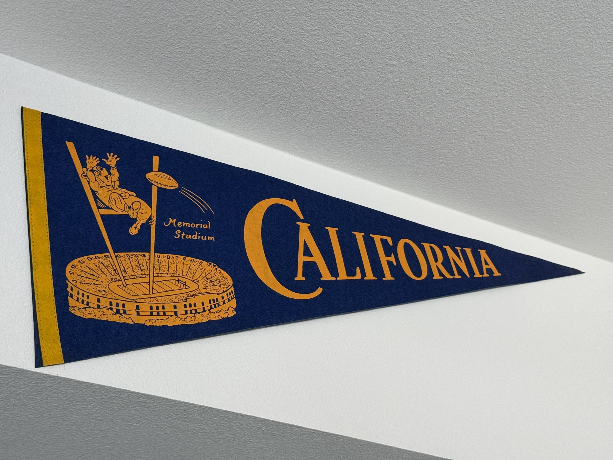 Blue and gold California pennant with Oski and Memorial Stadium, displayed in BearSquared?s kids room. Photo credit: BearSquared (@CalBearSquared). Photo credit: BearSquared (@CalBearSquared).